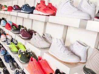 Sneakers on a store shelf, for an Authentic Brands chief legal officer hire