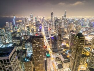 Chicago skyline at night, home of the Chicago general counsel pay report