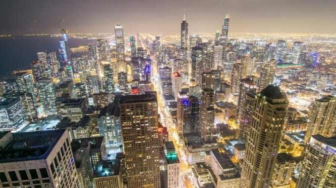 Chicago skyline at night, home of the Chicago general counsel pay report