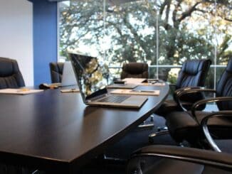 Empty boardroom table, a nod to general counsel pay disclosed in Fox’s 8-K