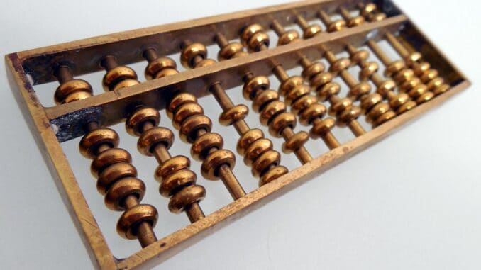 Wooden abacus for general counsel CFO budget talks