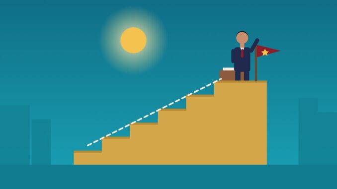 How to Become a General Counsel How to become a general counsel: a lawyer at the top of a staircase beside a flag