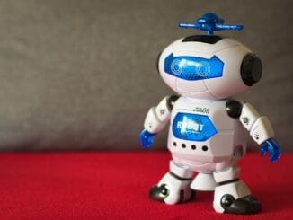 Small DIY robot kit with wheels and eyes, in-house AI