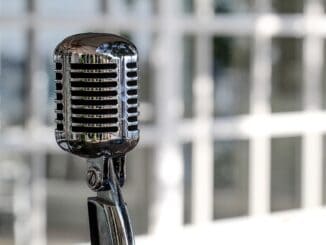 Vintage microphone: Microsoft's top lawyer takes charge of communications
