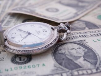 Pocket watch on US dollar bills, a nod to partner billing rates rising as billable hours fall
