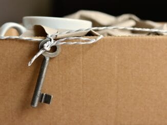Cardboard box with an old key for a post on the Weil Gotshal dissolution