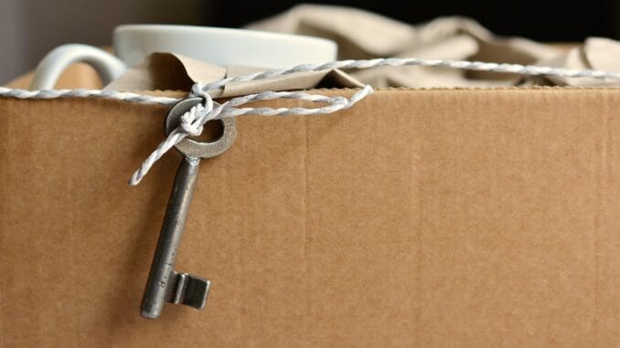 Cardboard box with an old key for a post on the Weil Gotshal dissolution