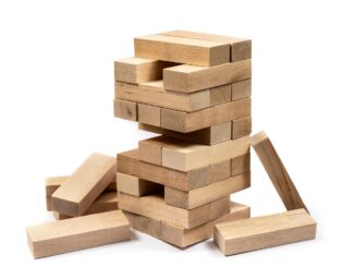 Wooden block tower collapsing, a Weil Gotshal law firm crisis concept